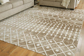 Warmstead Furniture - Ashley Furniture - Bunchly Rug - 7'10" x 10'3" Washable Rug / Tan/Brown/Cream - R406221